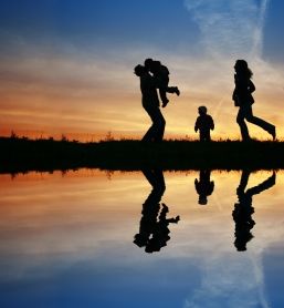 Silhouette of a family at sunset.